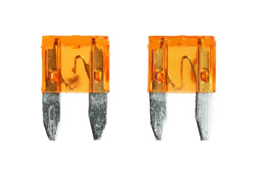 A blown fuse next to a new fuse