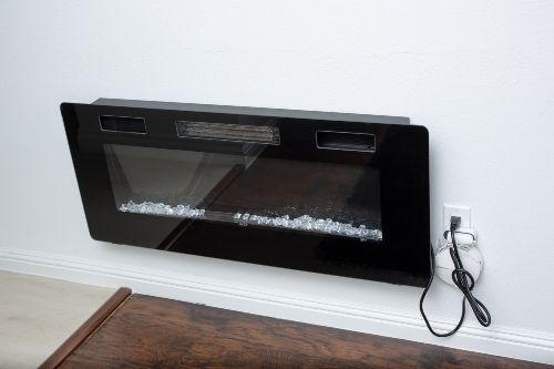 electric fireplace plugged into an electrical outlet electric fireplace plugged into an electrical outlet