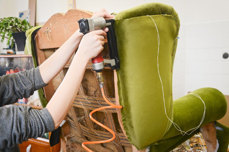 Person Reupholstering A Green Chair