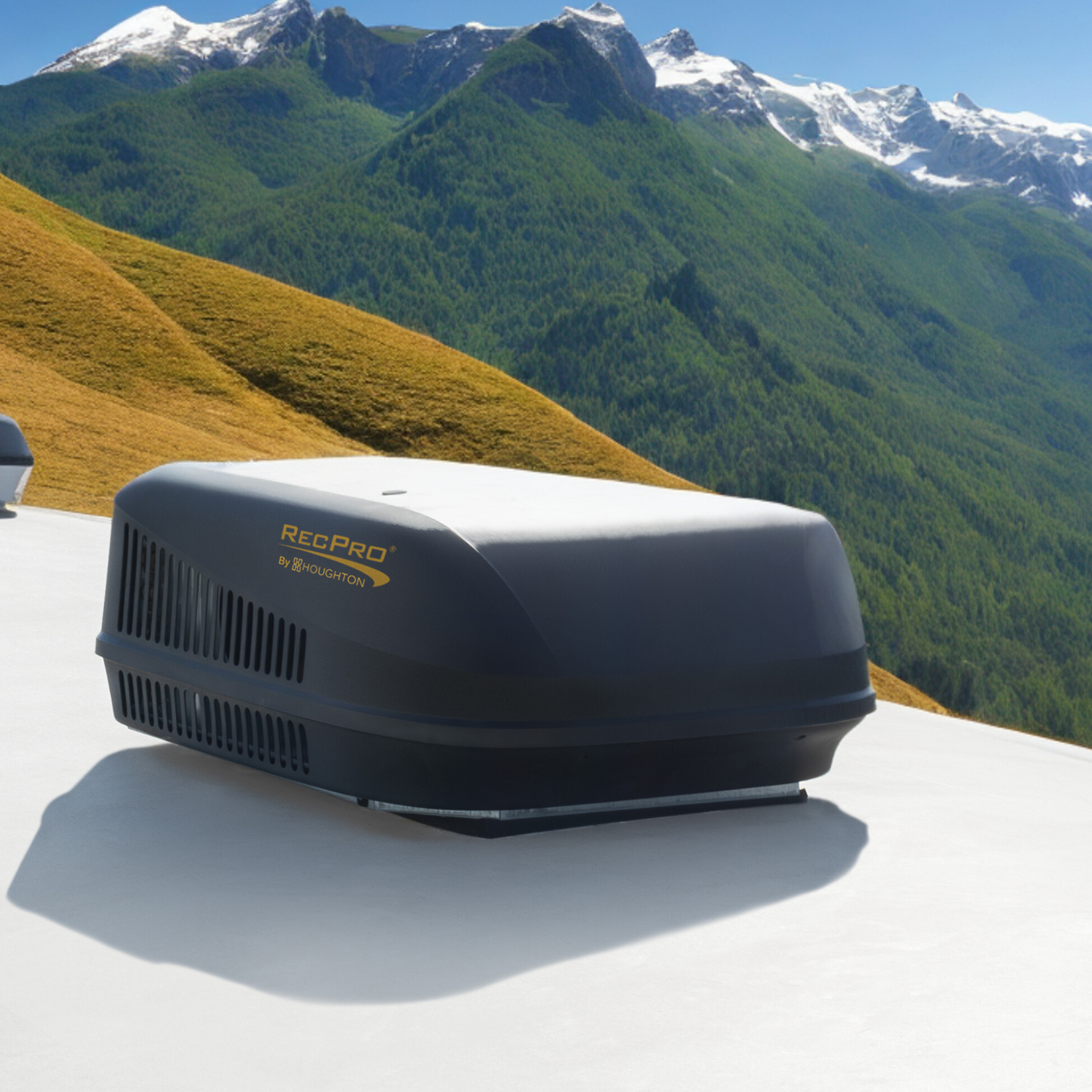 RecPro Air Conditioner On An RV Rooftop RecPro Air Conditioner On An RV Rooftop With Mountains In The Background